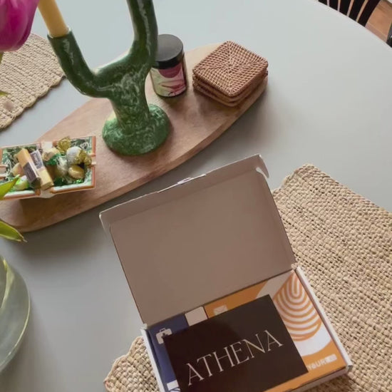 An overview of all the components of an at-home fertility test including instructions, disposable lancets, alcohol wipe, bandage collection tube and return kit.